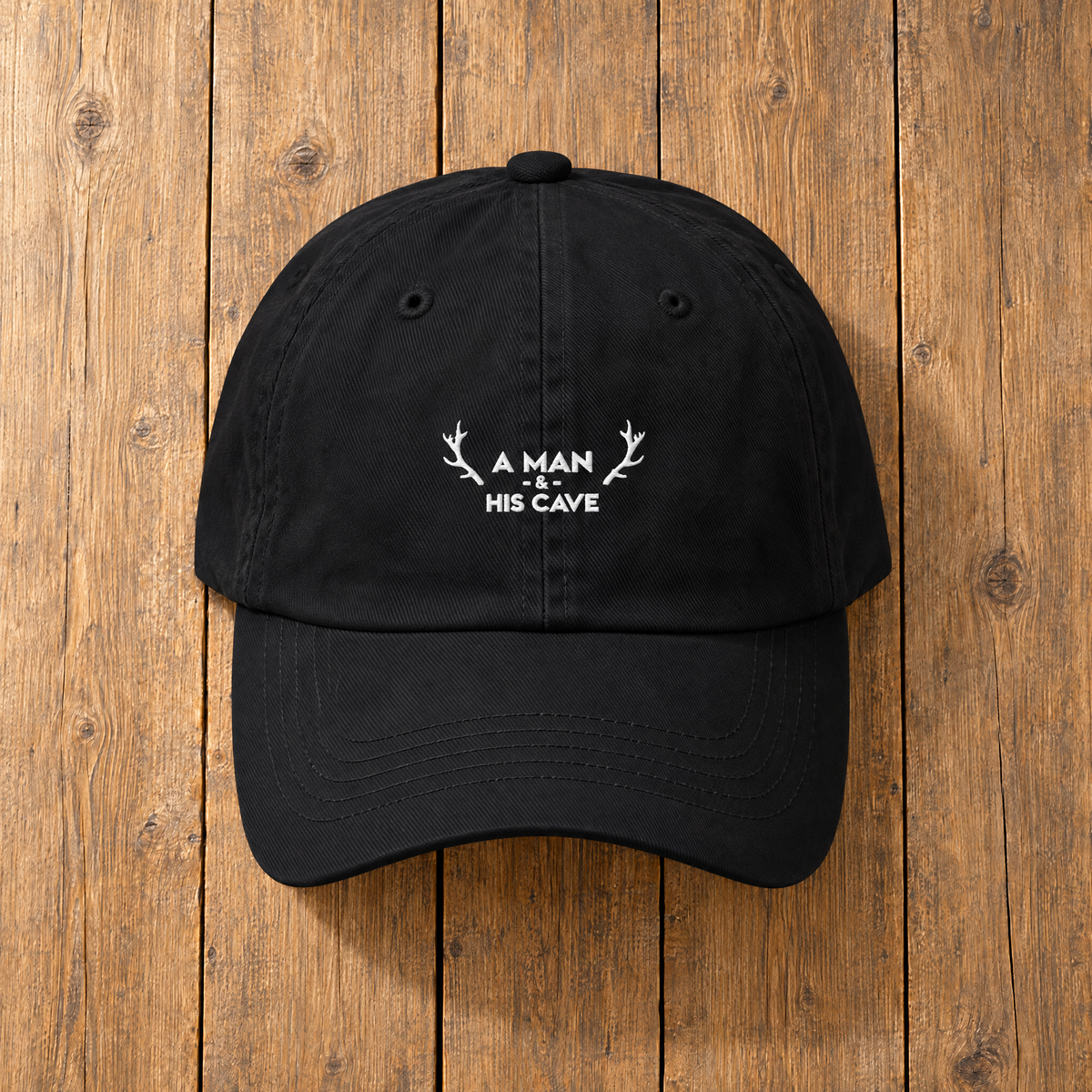 Black AMAHC logo dad cap on timber