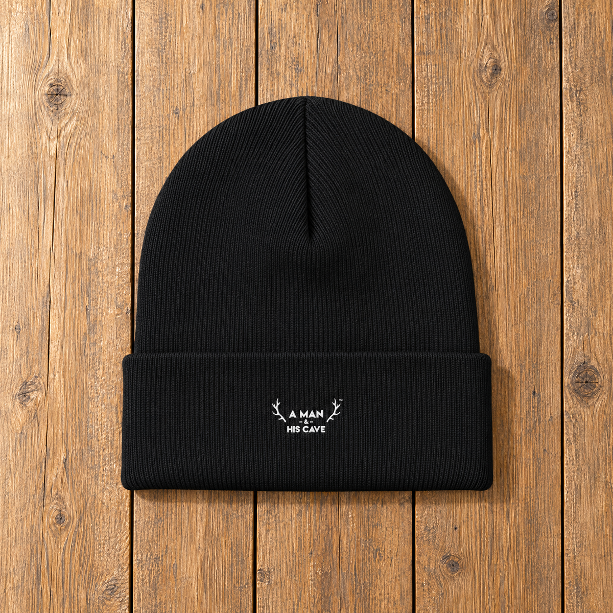 Black AMAHC logo beanie laid flat on timber