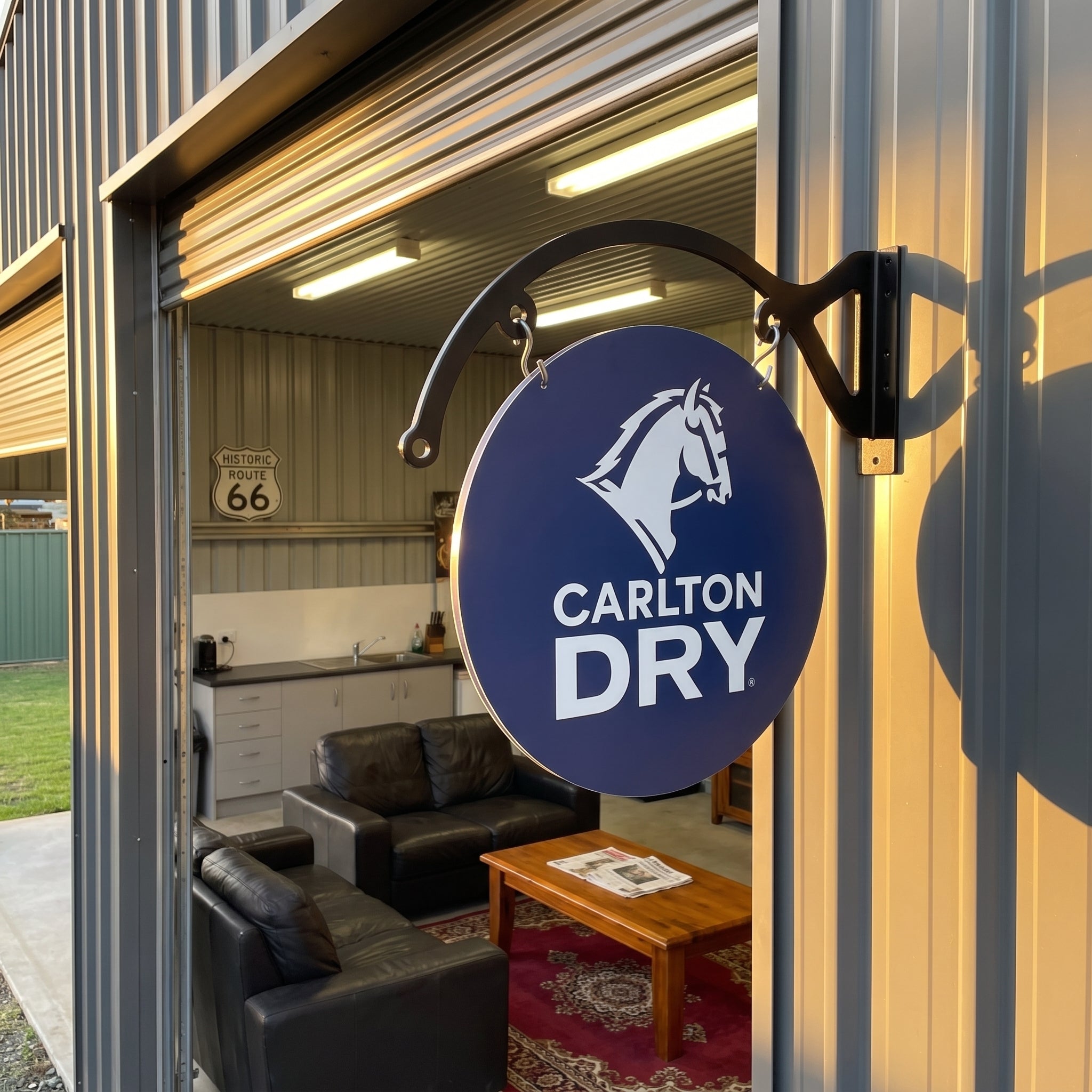 Carlton Dry round metal sign at a shed man cave lounge
