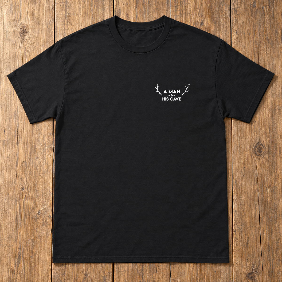 Black AMAHC logo tee laid flat on timber
