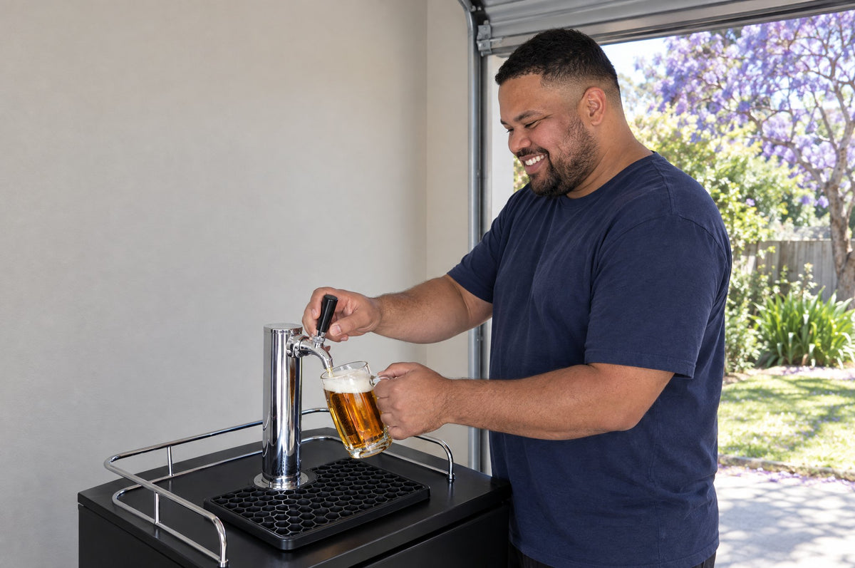 Pouring a beer from a single-tap kegerator in a garage bar