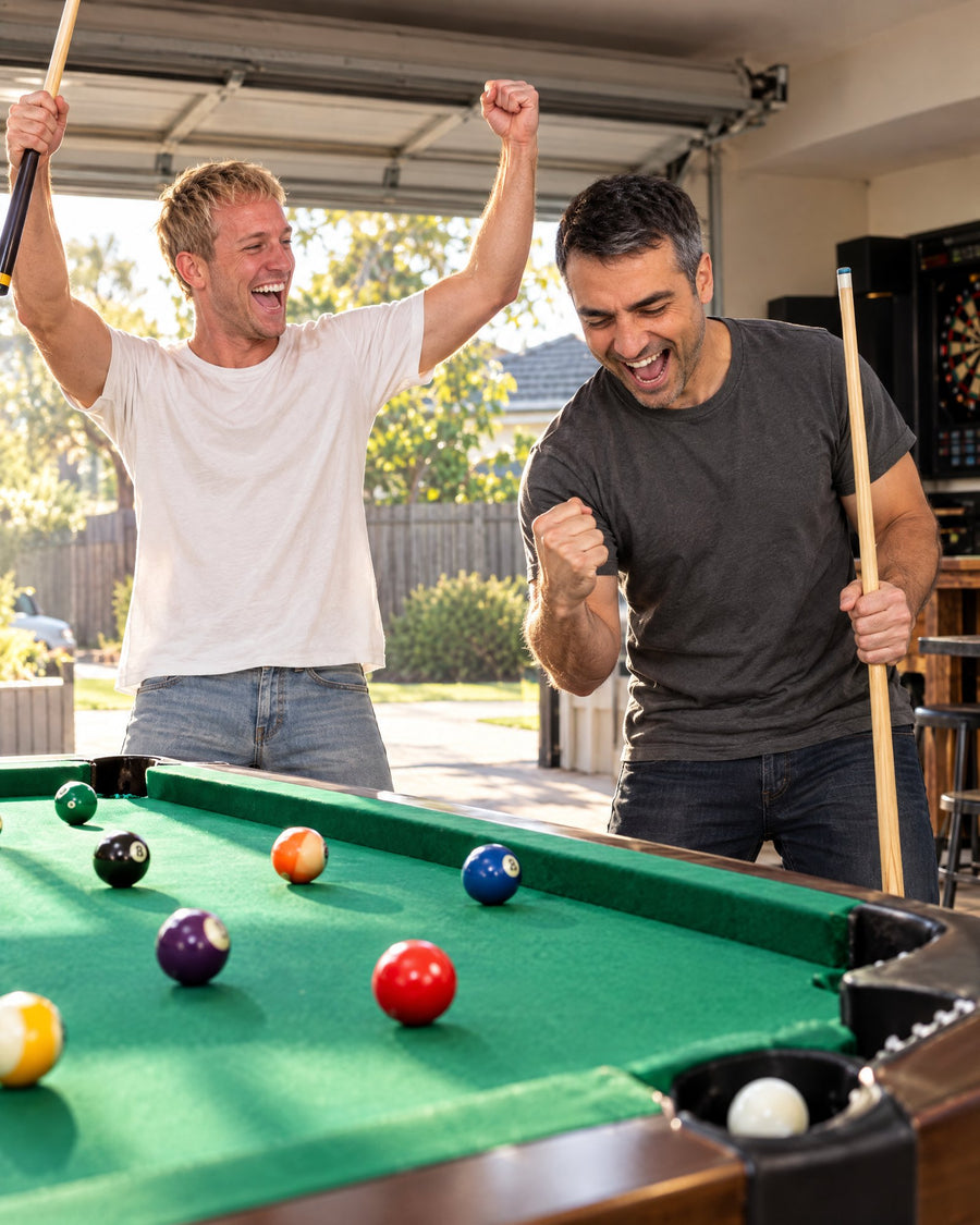 The shot drops: one mate fist-pumps, the other throws his arms up