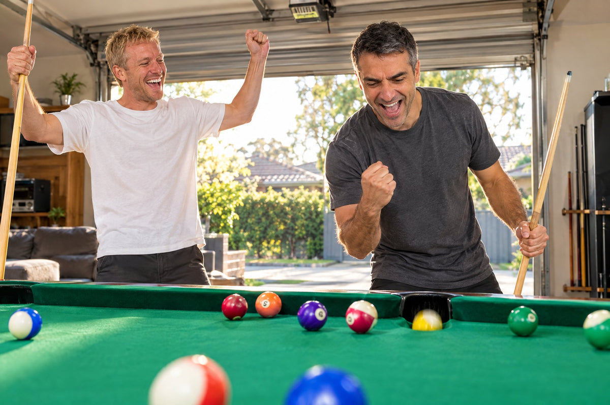 The shot drops: one mate fist-pumps, the other throws his arms up